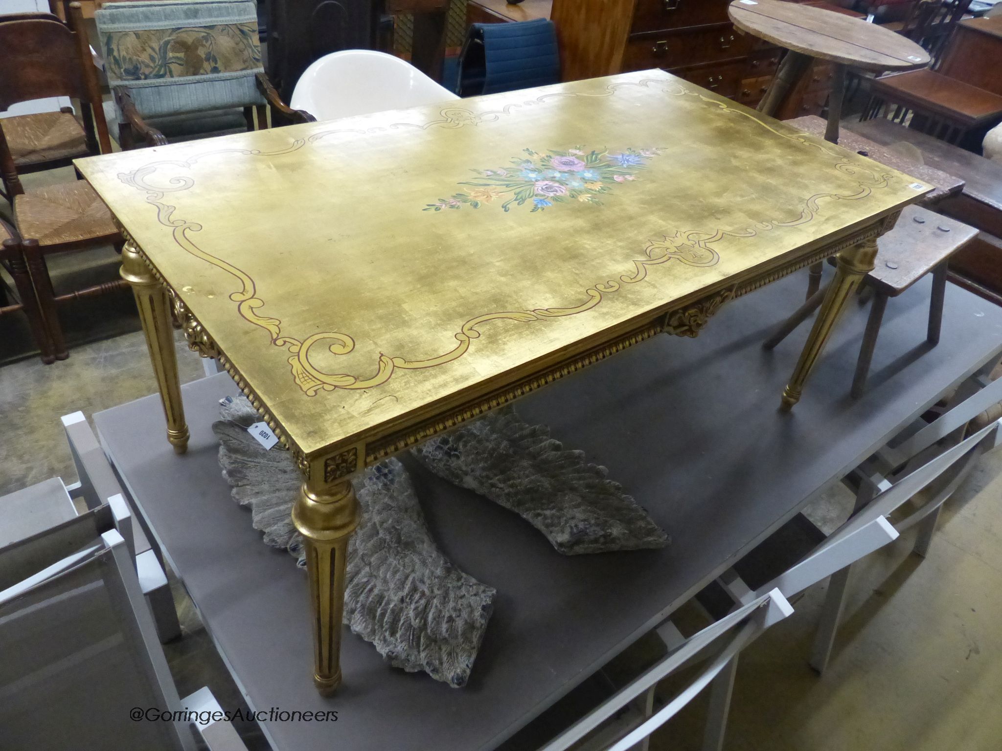 A rectangular painted gilt coffee table, width 125cm, depth 67cm, height 55cm